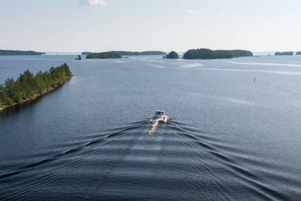 istock Landscape of Saimaa lake, ship and wake wave 658911376