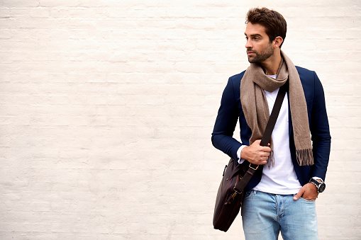 Handsome dude in scarf and jacket, looking away