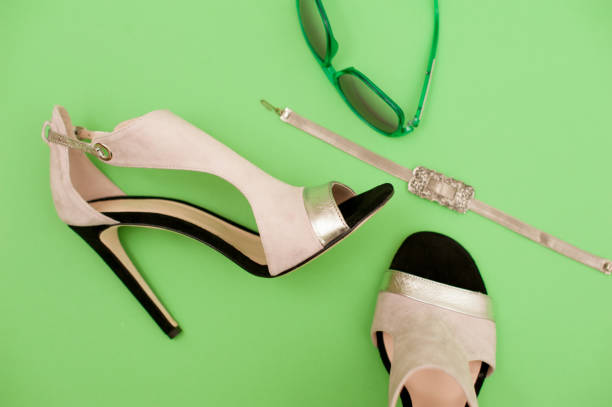 istock Elegant Woman Sandals On Green Background With Accessory 658912922