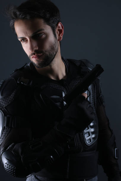 istock Super cops -  Handsome policeman holding a gun 658918142