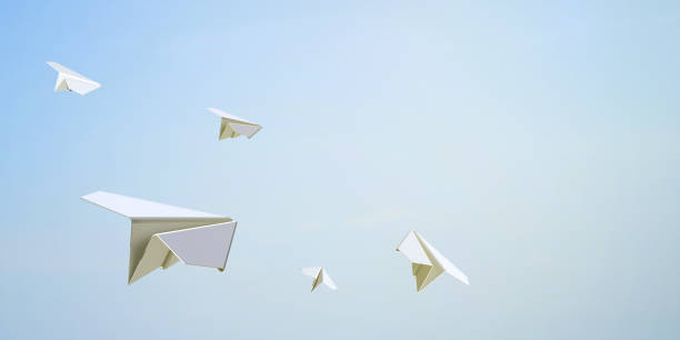 Paper Airplane Flying Freedom on Sky Background Paper Airplane Flying Freedom on Sky Background / Creative freedom and Concept Art paper airplane photos stock pictures, royalty-free photos & images