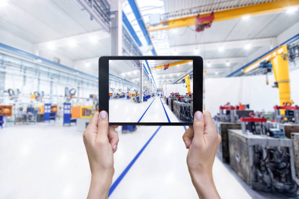 istock Digital tablet & aisle in factory 658930000