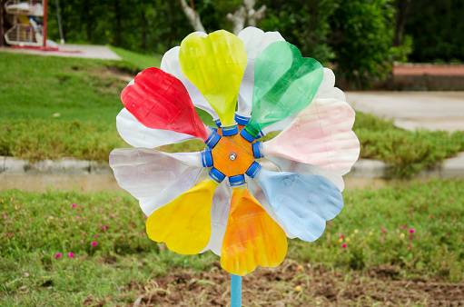 Colorful pinwheel and windmill toy made from plastic bottle recycle