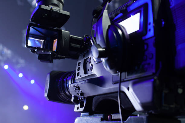 istock tv camera in a concert hal. Professional digital video camera. 658938232