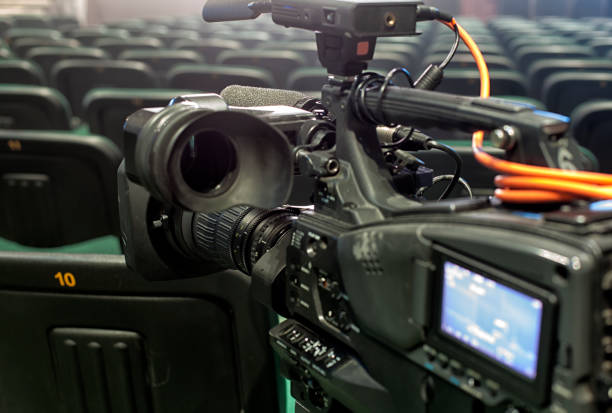 istock tv camera in a concert hal. Professional digital video camera. 658938392