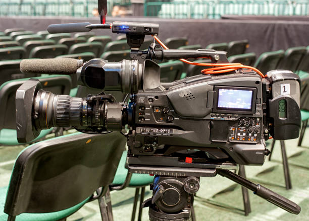 istock tv camera in a concert hal. Professional digital video camera. 658938832