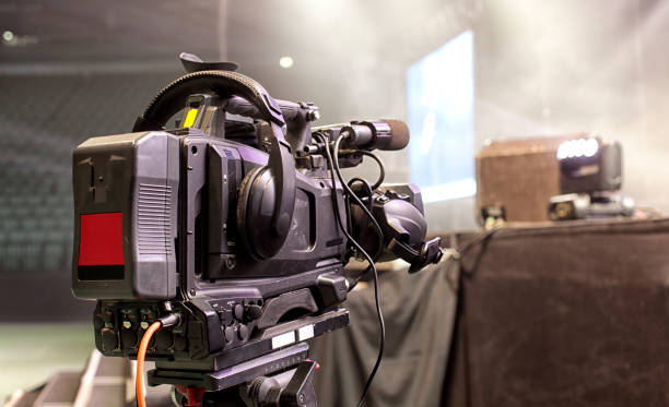 istock tv camera in a concert hal. Professional digital video camera. 658938860