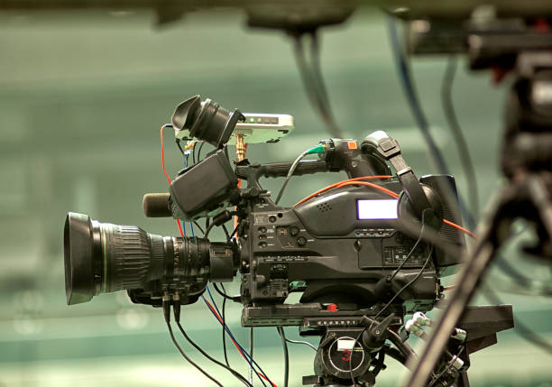 istock tv camera in a concert hal. Professional digital video camera. 658939284