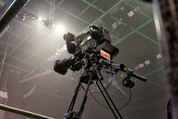 istock tv camera in a concert hal. Professional digital video camera. 658939430