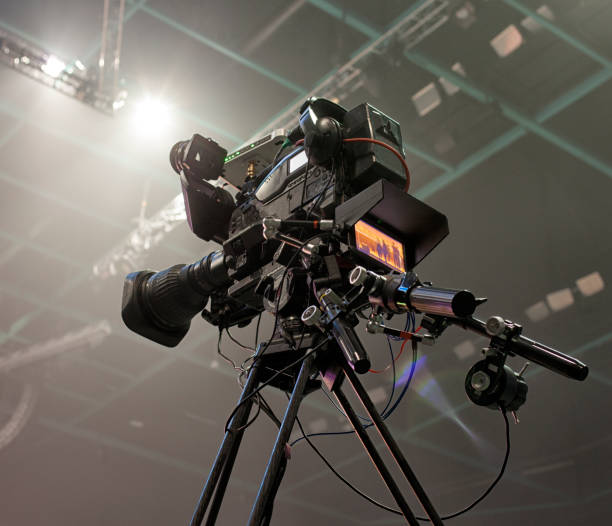 istock tv camera in a concert hal. Professional digital video camera. 658939462
