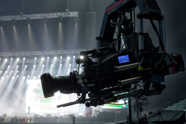 istock tv camera in a concert hal. Professional digital video camera. 658939488
