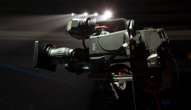 istock tv camera in a concert hal. Professional digital video camera. 658939642