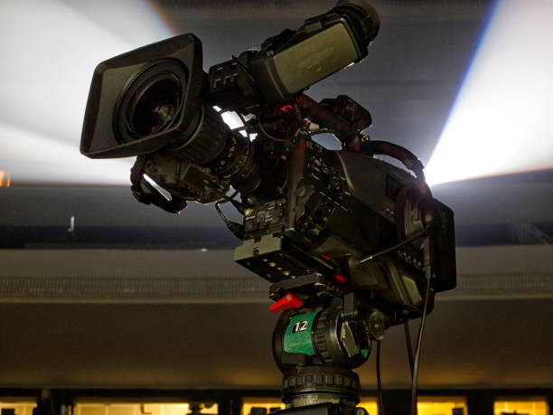 istock tv camera in a concert hal. Professional digital video camera. 658940004