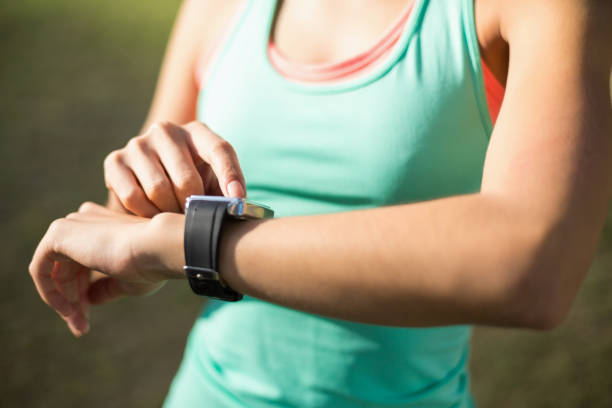 istock Woman adjusting a time on wristwatch 658945956