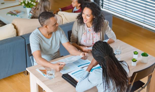 istock Insurance agent discussing with couple 658962442