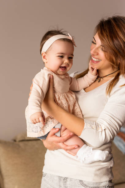 istock Mother holding her baby 658964364