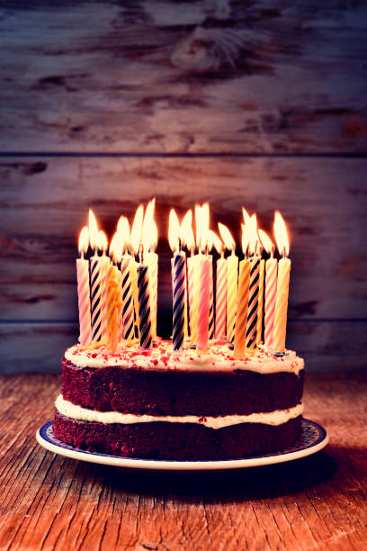 istock birthday cake with many lit candles 658973670