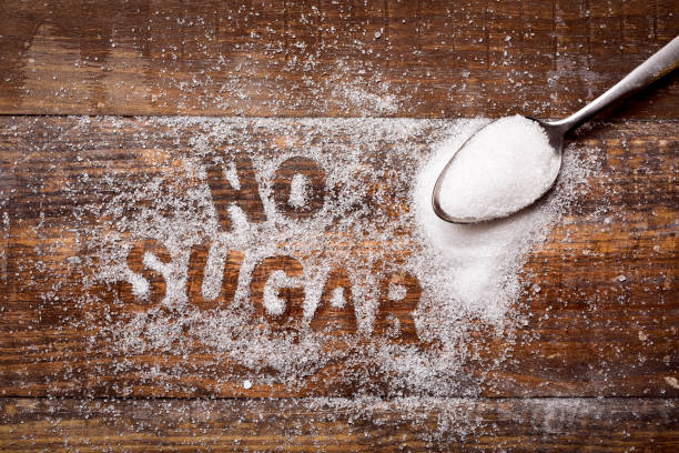 text no sugar written with sugar stock photo
