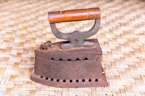 istock Old iron on rattan weave mat 658990798