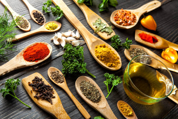 istock Various spice on wooden spoons with herbs 658991410