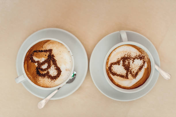 istock Coffee cup with milk and heart shape on a table. 658991460