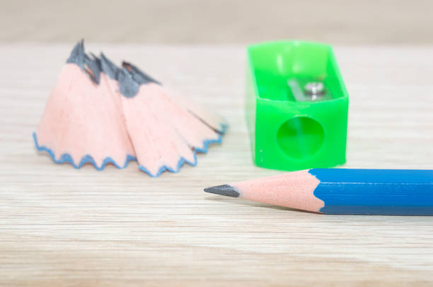 istock A pencil sharpener shavings on wooden background 658991554
