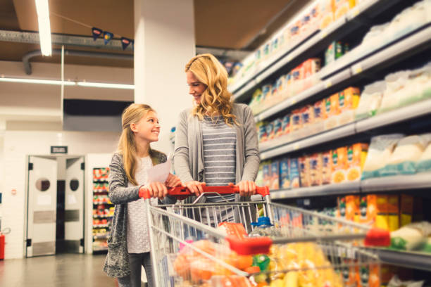 istock Mother and Daughter In A Supermarket 658993632