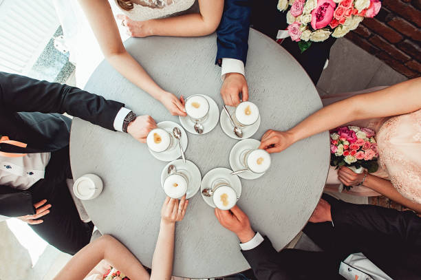 istock People holding in hands cups with coffe. 659007740