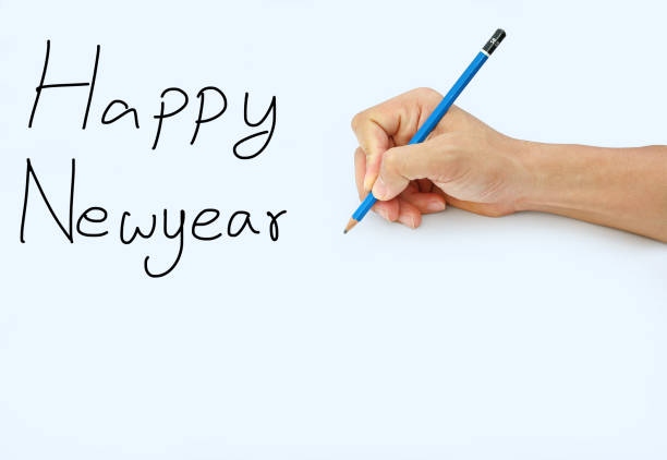 istock Hand holding a pencil on a white paper background. 659028608