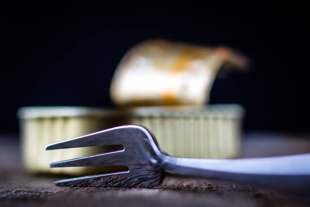Can and fork on the table in the old kitchen
