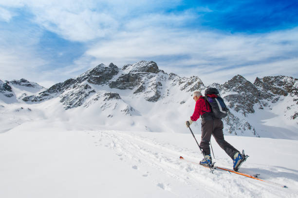 Fresh ski tracks in snow after Telemark skier in high Norwegian mountains in Jotunheimen National Park in Norway.