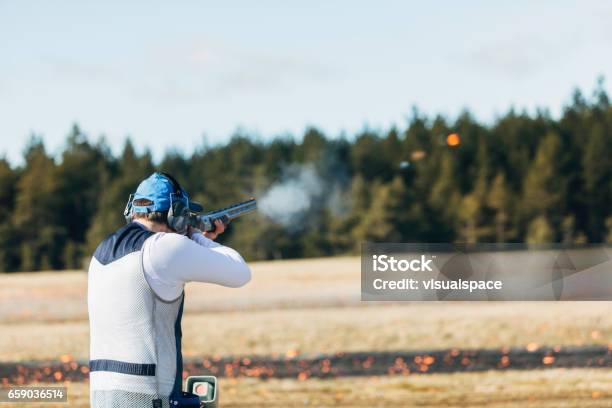 Clay Target Shooter Stock Photo - Download Image Now - Skeet Shooting, Target Shooting, Shooting a Weapon