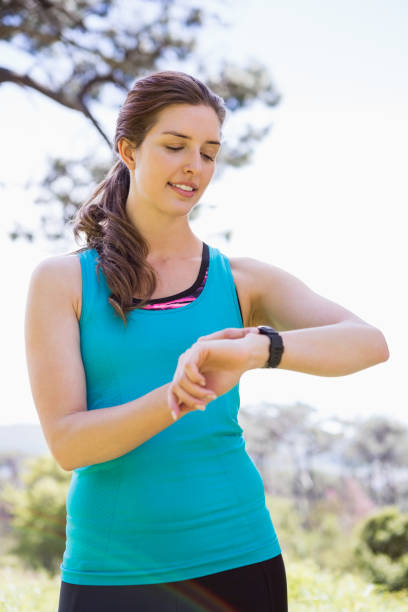 istock Smiling woman checking her watch 659057678