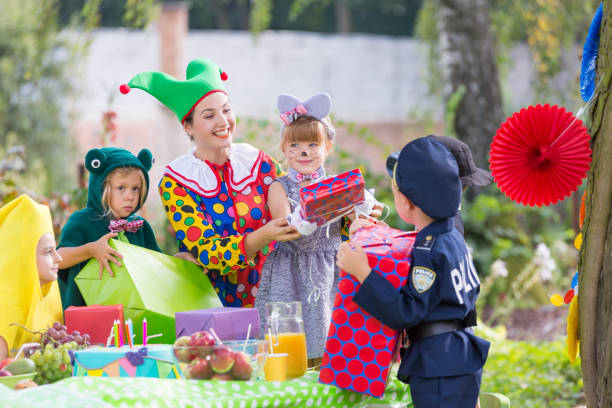istock Party entertainer with children 659066540