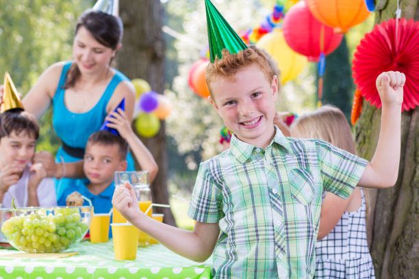 istock Birthday boy wearing party hat 659066608