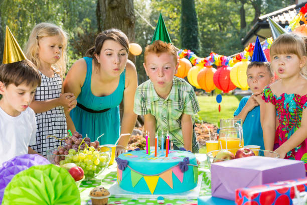 istock Birthday boy blowing up candles 659066612
