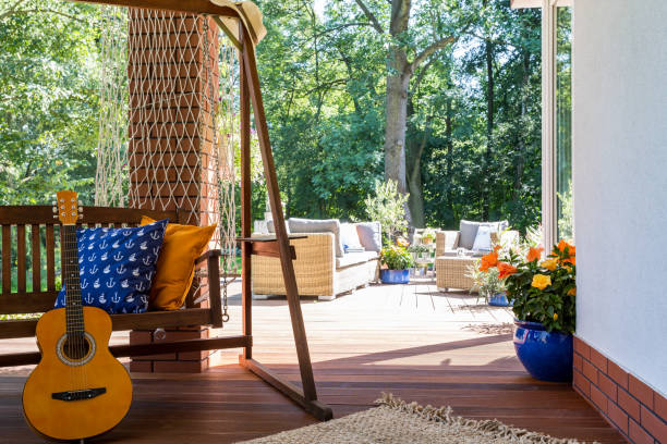 istock A guitar standing beside a garden swing 659101434