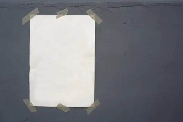sheet stuck with sticky tape on background