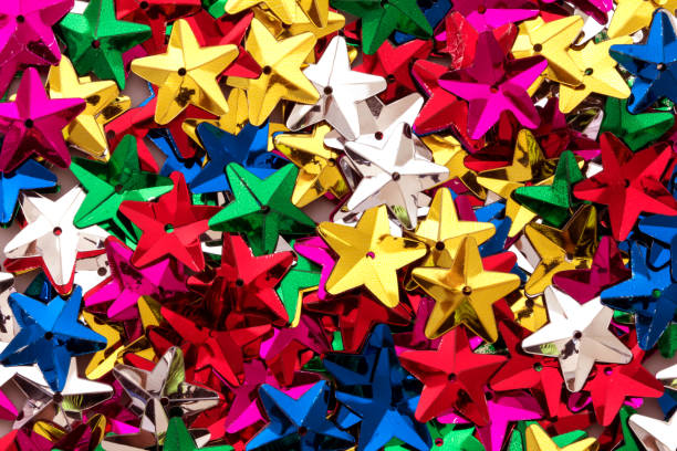 istock Shiny colorful sequins of  star shape  texture background 659114072