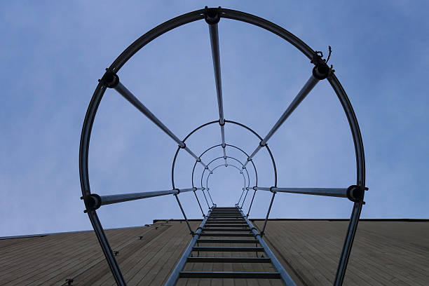 istock Low Angle View Of Fire Escape Against Blue Sky 659118961