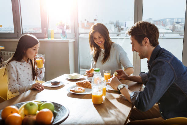 istock young family having breakfast together 659120988