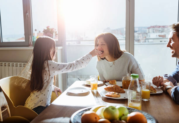 istock young family having breakfast together 659121154