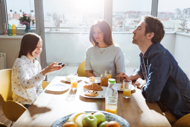 istock young family having breakfast together 659121606
