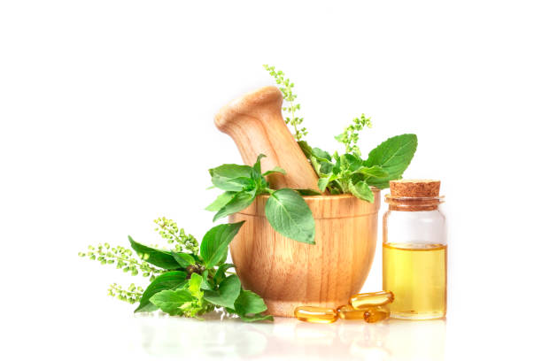 istock basil in wooden mortar with essential oil 659122068