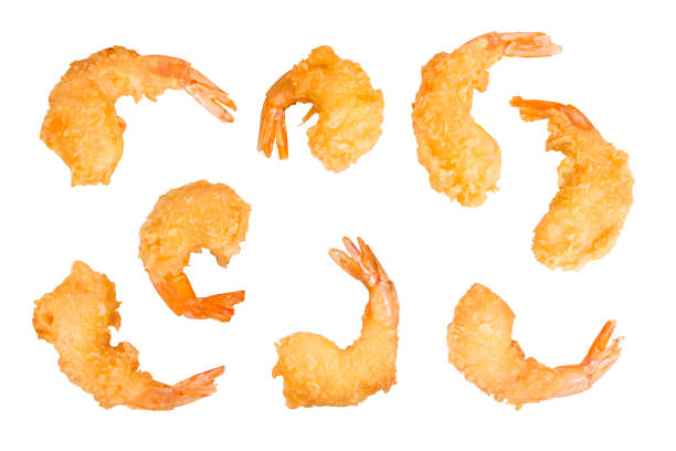 Set of batter-fried prawns isolated on white Set of batter-fried prawns isolated on white with clipping path breaded photos stock pictures, royalty-free photos & images