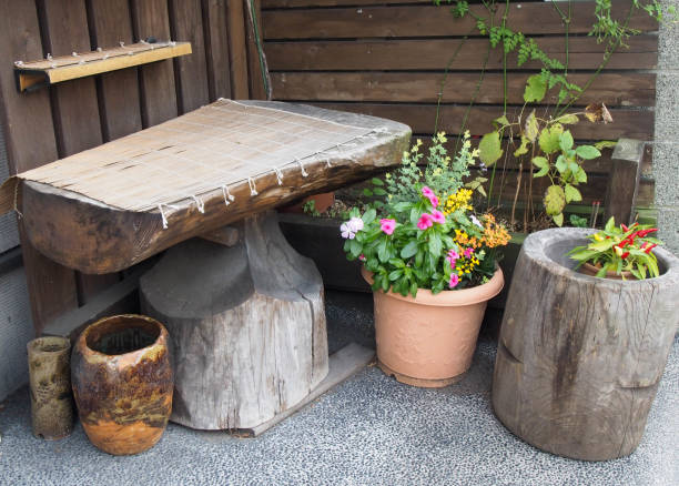 istock wooden table among the plants in pot 659131790