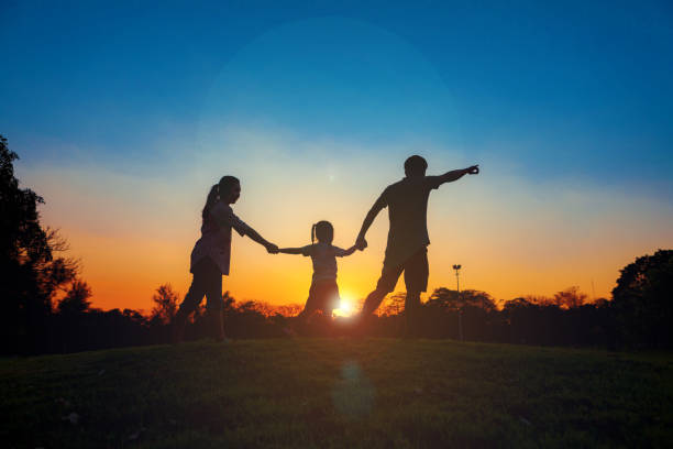 istock Family silhouette with sunset. 659137372