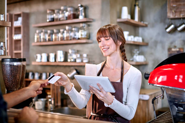 istock Staff Serving Customer In Busy Coffee Shop 659144126