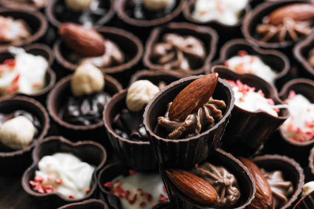 istock Dessert candy bar with chocolate sweets on wooden brown dark background 659149832