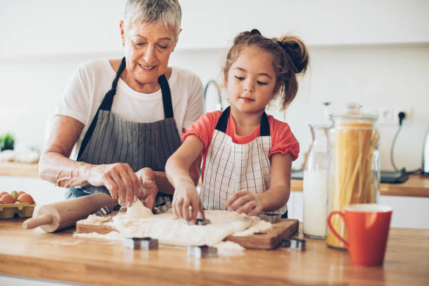 istock Little girl helping in the kitchen 659151916